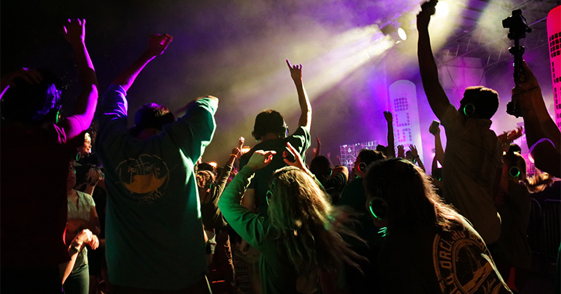 Students dancing at a silent disco on The Green