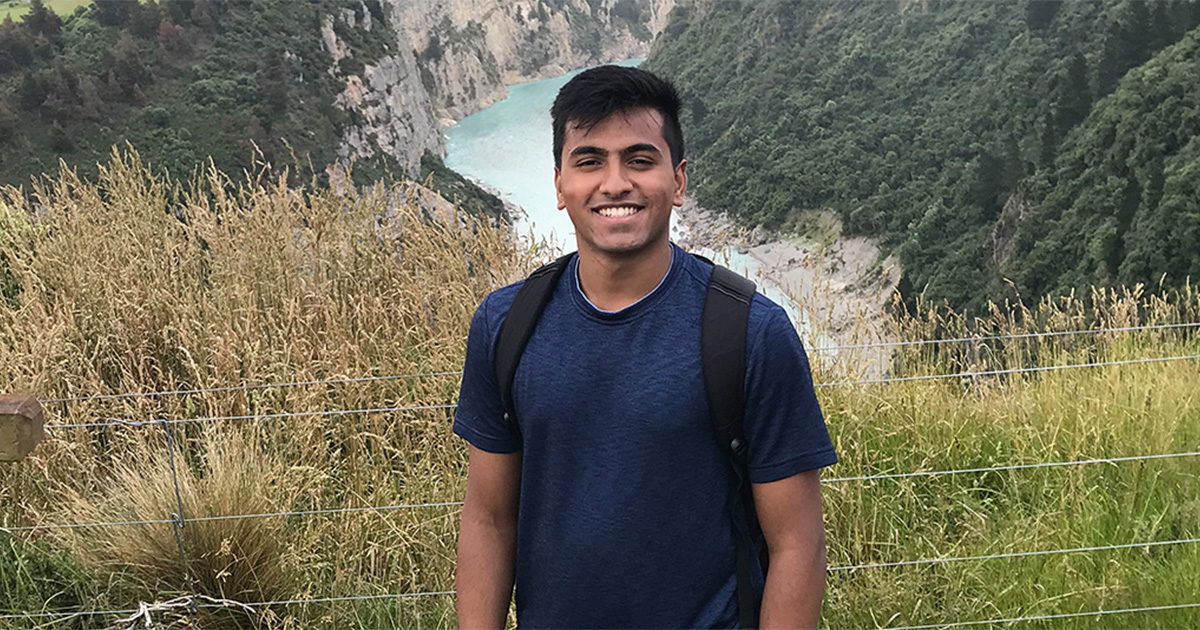 Nishant Chintala hiking near a river