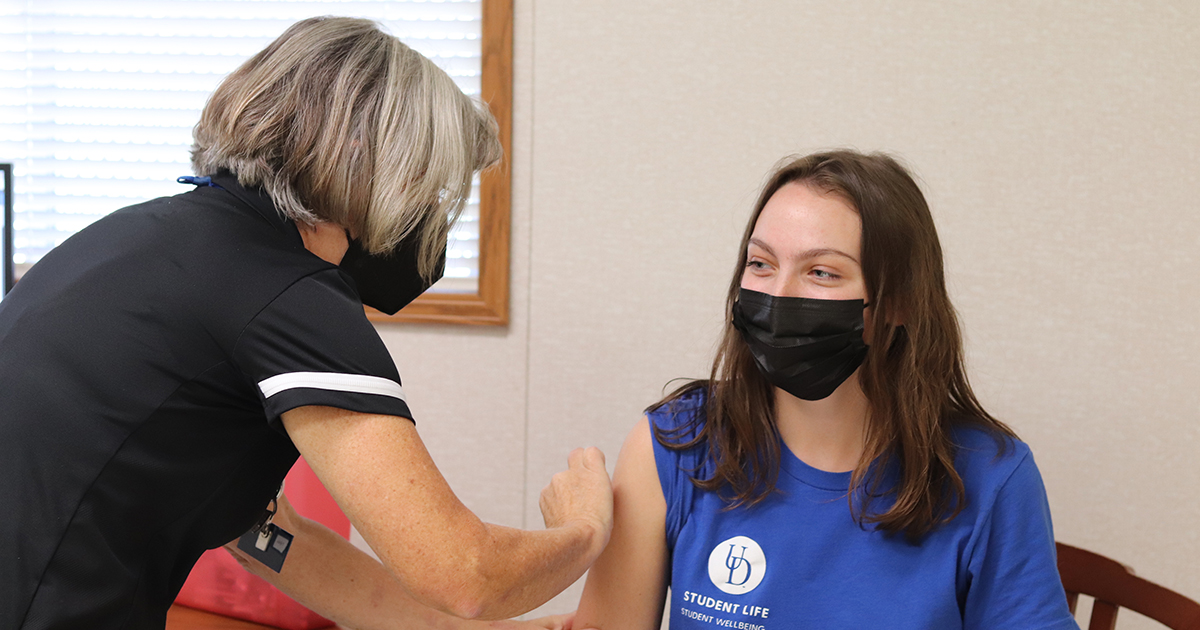 Student receives flu shot in SHS Annex