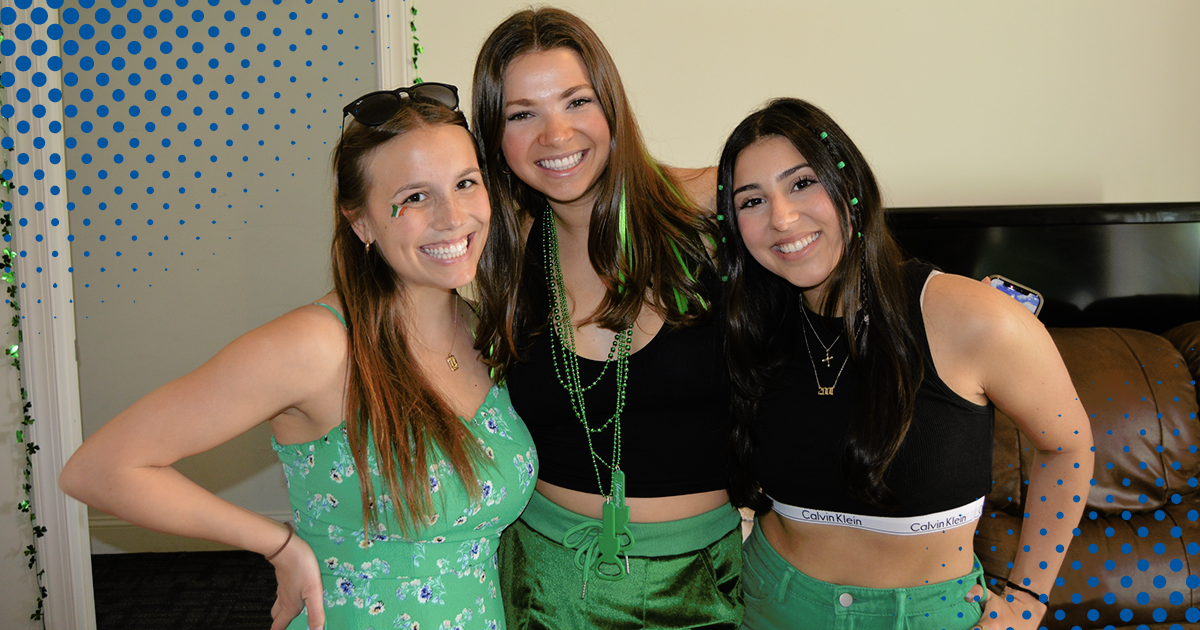 Three students in green St. Patrick's day clothing