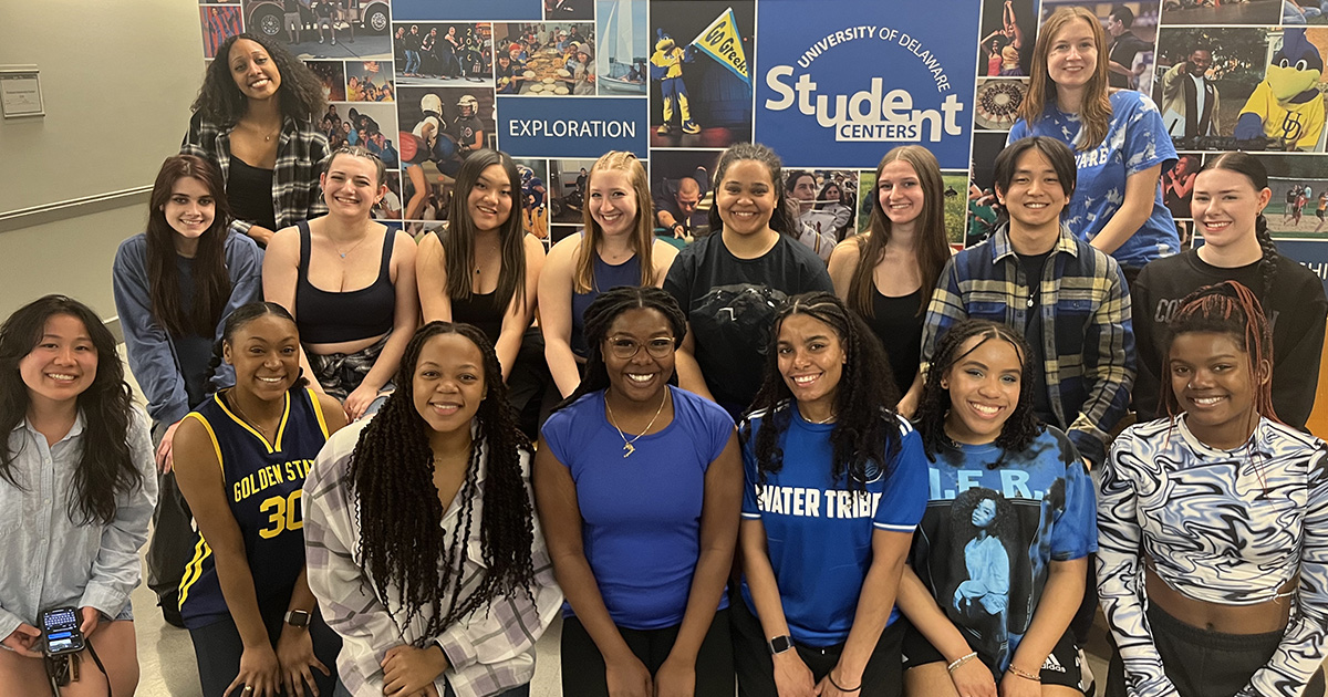 Members of Isodynamic Hip Hop Dance Crew members pose in front of Student Centers collage