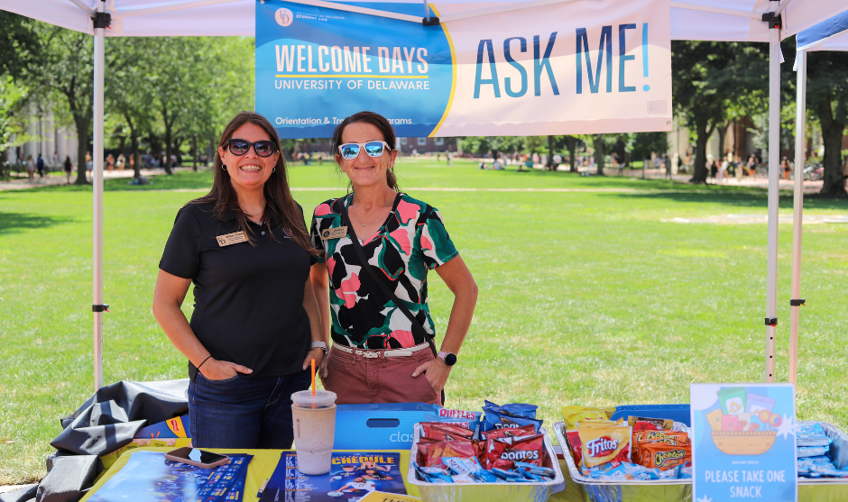 Student Life staff work at an Ask Me! Tent