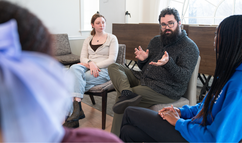 Therapist speaks with a group of students