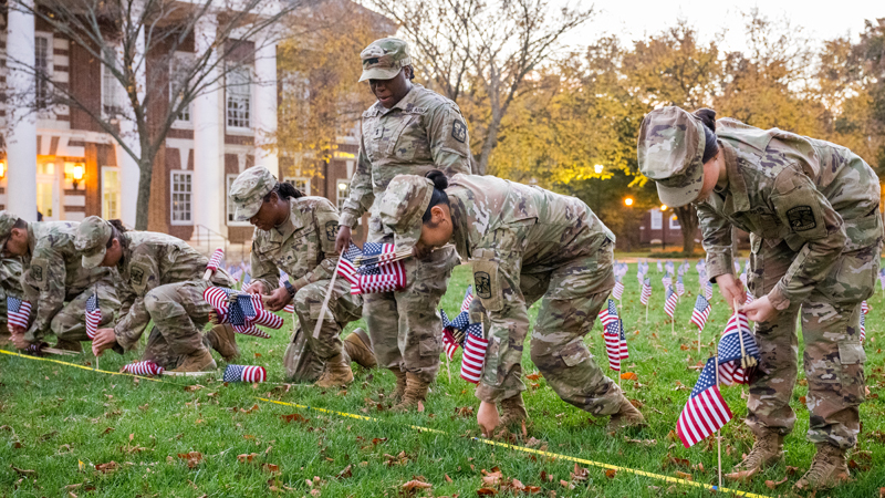 cadets in the AROTC plant flags on The Green for Veterans' Day.