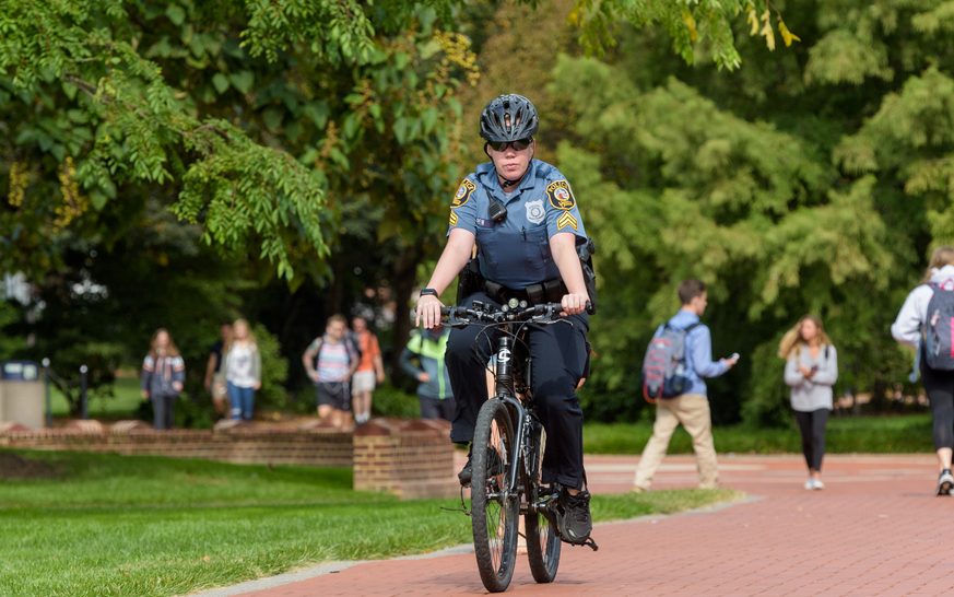 Police-Green_Vehicles-Foot_Patrol-091217 University of Delaware Police Department green vehicles - including electric motorcycles, electric "cart", and bicycles which reduce the environmental footprint of the department while also improving the safety of campus. - (Evan Krape / University of Delaware)