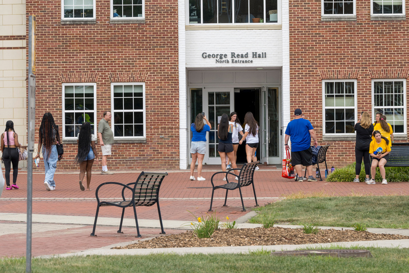 students walk toward George Read residence hall