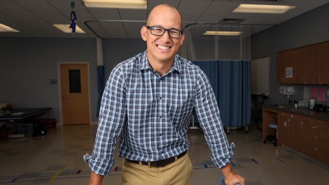 PT-White-Exercise_Research-082216 Daniel White is a researcher and assistant professor in Physical Therapy who is looking into methods to encourage PT patients to get more exercise by having them look into how they can integrate exercise into their normal routine by, for example, taking the stairs instead of an elevator or parking further from their destination to encourage walking more. - (Evan Krape / University of Delaware)