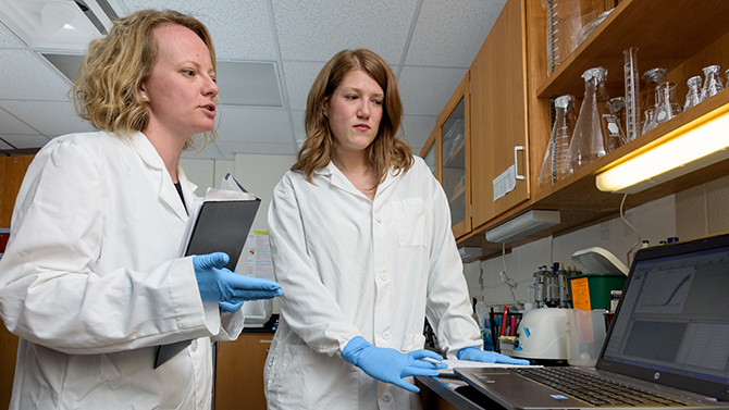 Jackie Schwarz is an assistant professor in Psychological and Brain Sciences who's work investigates how immune system activation can influence the brain and behavior throughout the lifespan of an individual. Photographed with her graduate student Brittany Osborne in Mckinly Lab to accompany the announcement of her recently awarded grant from the National Institutes of Health. - (Evan Krape / University of Delaware)