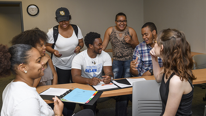 McNairs Scholars participate in a seminar on writing resumes at Career Services as part of their summer learning.