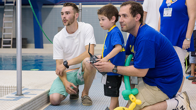 AW-CEOE-Meet_The_Robotic_Fleet-060416 Alumni Weekend 2016 - College of Earth, Ocean, and Environment's "Under the Sea: Meet the Robotic Fleet" showcase held at the indoor pool in the Carpenter Sports Building. The event featured active and static demonstrations of various Remotely Operated Vehicles (ROVs) and Autonomous Underwater Vehicles (AUVs) and gave visits the chance to try piloting a tethered ROV. - (Evan Krape / University of Delaware)
