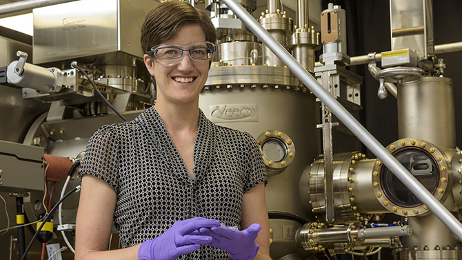 Dr. Stephanie Law, Materials Science works with doctoral students Theresa (Tess) Ginley (royal blue shirt) and
Dongxia Wei with the MBE:Molecular Beam Epitaxy machine.