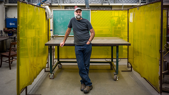 David Meyer, associate professor of Art and Design, photographed in the Studio Arts Building metal shop and his adjacent office for a UDaily article on his set design work with a unique production of Shakespeare's "Pericles: Price of Tyre" by Delaware Shakespeare. The company is touring the production to locations unusual for live theater which required to approach the set piece design in particularly innovative ways. - (Evan Krape / University of Delaware)