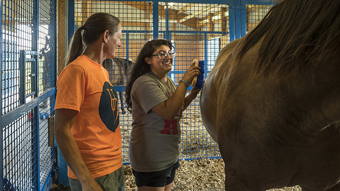William Penn High School FFA & Colonial School District Agriculture Students from William Penn High School's FFA participate in learning about agriculture at the Webb Farm and the UD Creamery. Dr. Biddle and Karen Ferrucci work with the kids.
