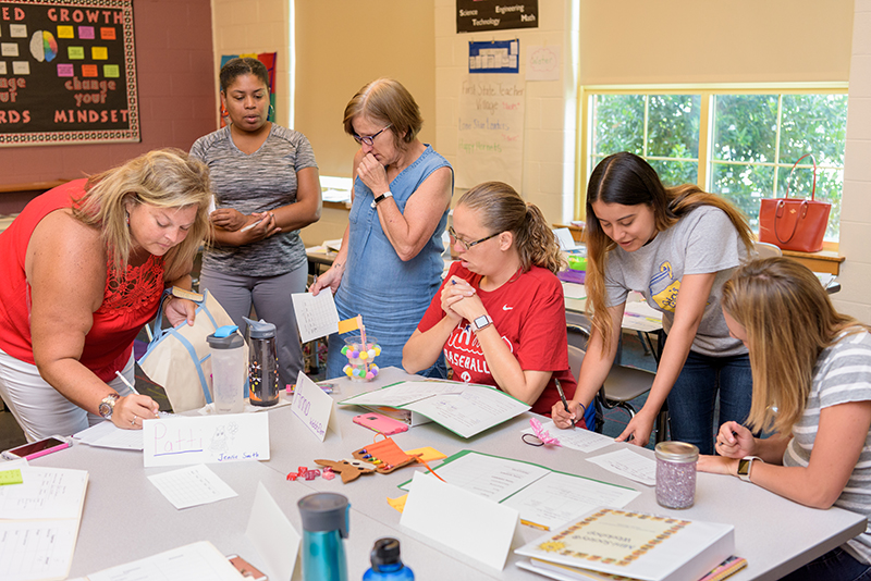 Twenty-five Delaware teachers participating in "Mini-Society training, an experience-based, inter-disciplinary economics and entrepreneurship learning system for children in grades 3-5. In Mini-Society children design and develop their own society and create a name, flag, and currency. Students establish businesses to provide goods and services to their fellow citizens. This workshop models classroom implementation of a Mini-Society." - (Evan Krape / University of Delaware)