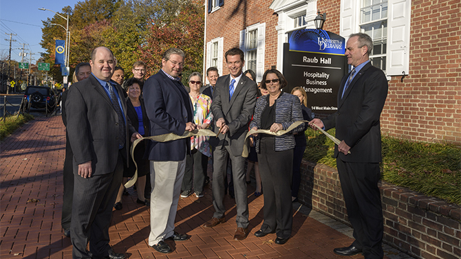 Hospitality Business Management - Ribbon Cutting Hospitality Business Management does a ribbon cutting to celebrate their new name change.
