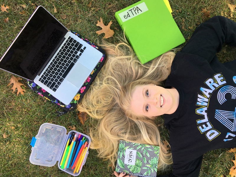 Associate of Arts graduate and UD senior Erika Komp on The Green.