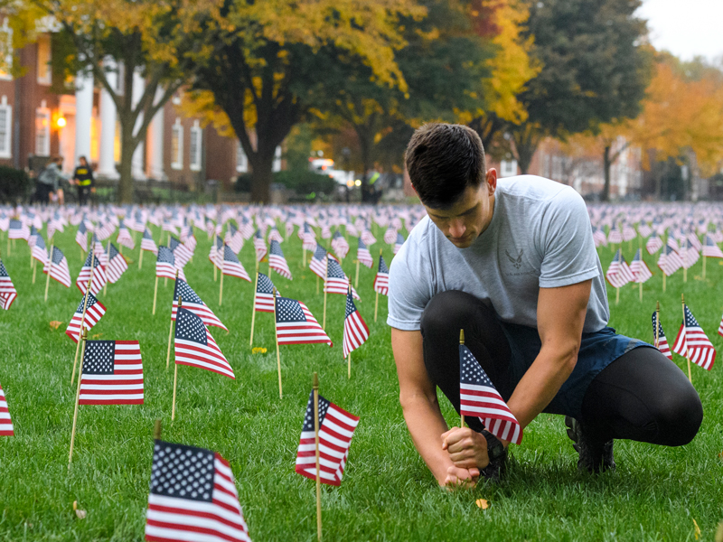 Veteran's Day Flag Planting Benjamin Von Duyke checks flags