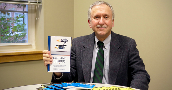 Robert Hampel displays his latest book Fast and Curious: A History of Shortcuts in American Education.