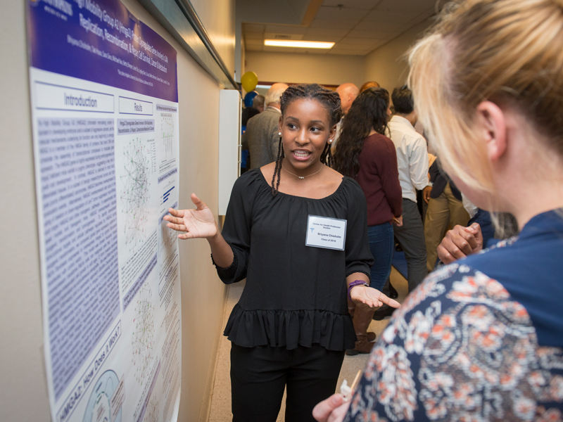 Briyana Chisholm at Heallth Profession Studies Open House Senior Briyana Chisholm’s summer research was on high mobility group proteins
