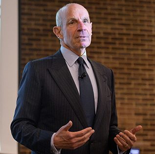Jonathan Tisch, CEO of Loews Hotels and co-owner of the New York Giants, gives a lecture to UD students on the hospitality industry and the importance of teamwork. Tisch also signed copies of his book during the visit.
