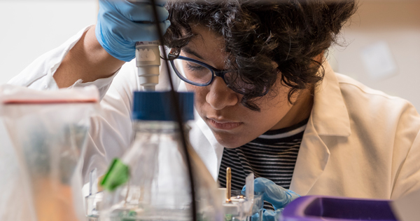 UD student Julie Sosa (working with the samples in multicolored tubes), in some photos with Jennifer Alexander (African American), a doctoral student who's been Julie's mentor this summer, and with Fox Chase faculty member Edna Cukierman, the primary researcher.
