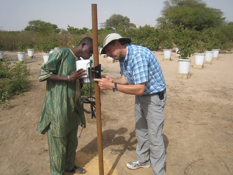 Installing a station at the Univ of Theis Senegal – 1.jpg: Water resource expert John Selker (pictured right) installing a weather monitoring station at the University of Theis in Senegal.
**I do not know the name of the other person in the image. If you want to amend the cutline to generalize, that’s fine with me. Thanks.
