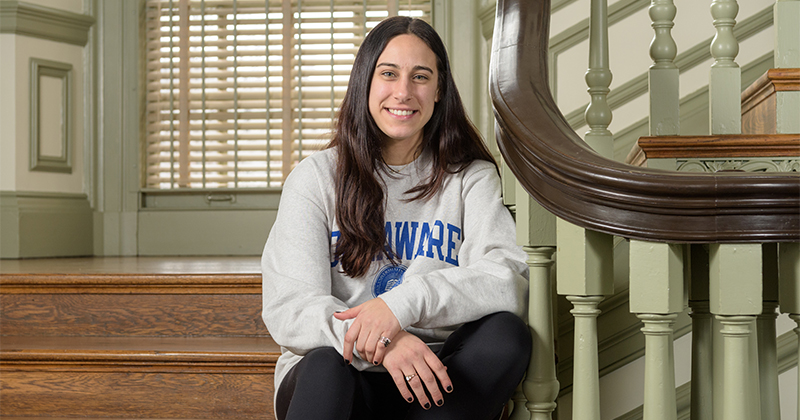 DAR-Bencivenga-Ashton-Scott-031418 Undergraduate seniors Sarah Bencivenga (sweatshirt) and Ede Ashton-Scott (long sleeve shirt) from the College of Arts and Sciences photographed for Development and Alumni Relations in the lobby and front steps of Old College Hall. - (Evan Krape / University of Delaware)