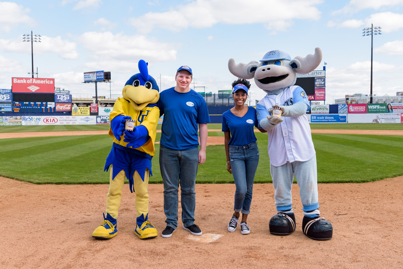 UDairy_Creamery-Blue_Rocks-Mascots-040518 From left, University of Delaware mascot YoUDee, UD Associate in Arts students Ronald Krischbaum and Olivia O’Neal, and Wilmington Blue Rocks mascot Rocky Bluewinkle celebrate the announcement that UDairy Creamery ice cream will be served at Frawley Stadium for Blue Rocks games.