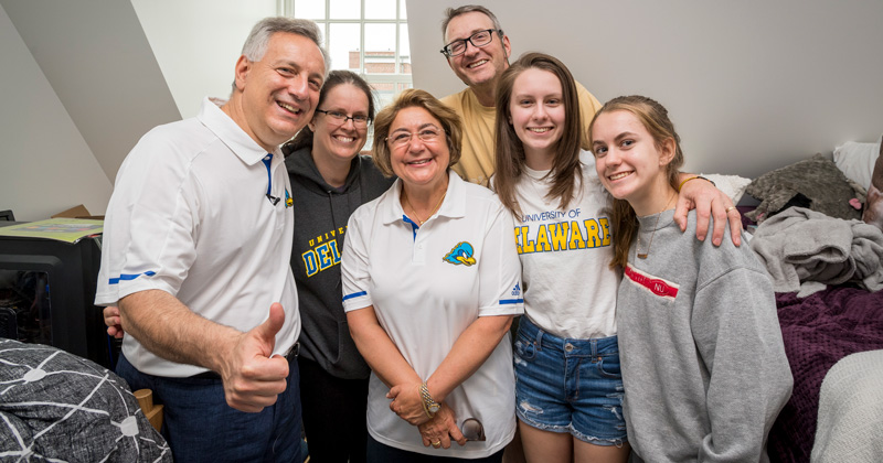 UD President Dennis Assanis (left) and his wife, Eleni  (third from left), met first-year student Bryn Kolmansberger (second from right) and her family on Saturday, Aug. 25 as new students moved into residence halls.