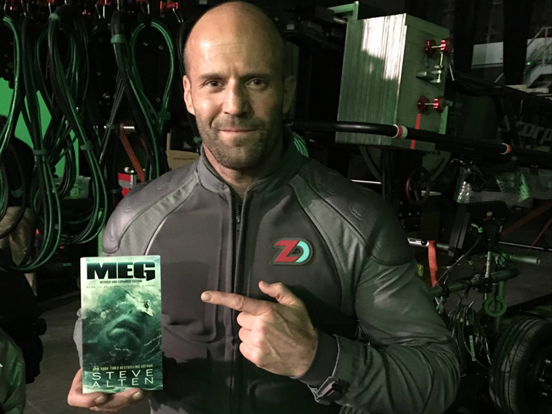 Actor Jason Statham holds Steve Alten’s book, “Meg,” which was turned into a movie scheduled for release on Aug. 10.