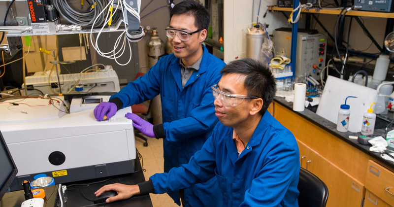 Bingjun Xu and Feng Jiao are pictured in their laboratory in Colburn Hall at the University of Delaware.