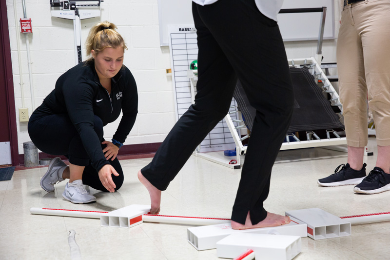 Alissa Strouse conducts research on what is known as the Y-Balance Test, to determine its usefulness in assessing the effects of a concussion.
