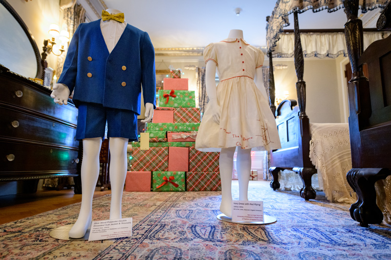 Clothing from UD's Historic Costume and Textiles Collection on display at the Nemours Mansion in Wilmington, Delaware as part of their 2018 holiday display. - (Evan Krape / University of Delaware)