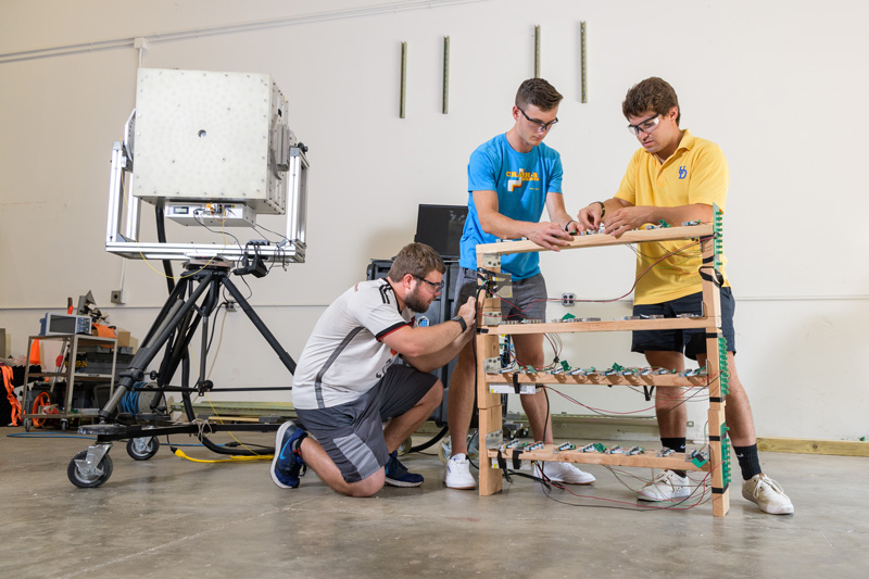 Dr. Dennis Prather, the College of Engineering Alumni Professor of Electrical and Computer Engineering oversees a team that includes current UD students and professors, as well as UD alumni. Working out of his UD lab and with Phase Sensitive Innovations (PSI), a spin-off company which specializes in "millimeter wave (mmW) imaging technology, systems and components", Dr. Prather lead a team to develop a millimeter wave "lightbulb" which can be used to locate and visualize metallic objects. Their work is now being funded by a $1 million Joint Improvised-Threat Defeat Organization (JIDO) grant. - (Evan Krape / University of Delaware)