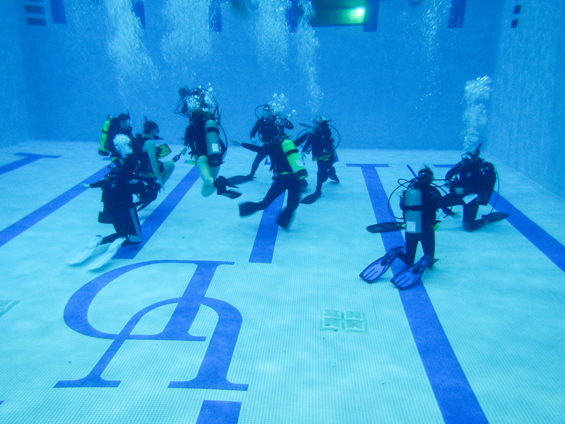 UD students in a scuba diving class at the bottom of the pool at the Carpenter Sports Building.