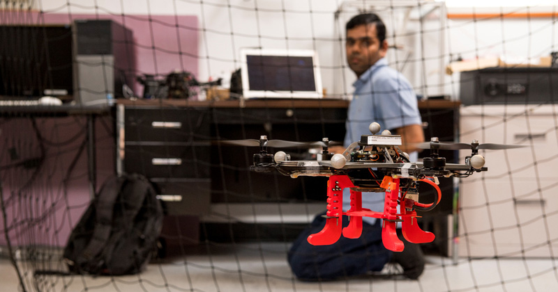 Mechanical engineering doctoral student Indrajeet Yadav flies a drone
