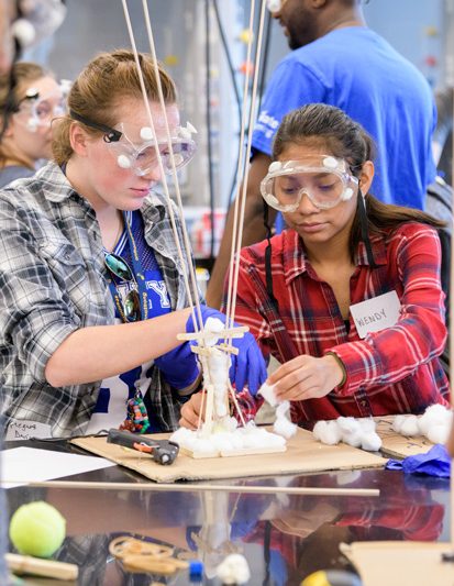 As part of the Student STEM Summer Academy, teams of teachers from Delaware high schools taught STEM / STEAM lessons they have developed to high schoolers from other Delaware high schools. The program acts as a test course, where teachers get the opportunity to teach their lesson to students - some who may not necessarily interested in STEM - and receive feedback on these lessons. Pictured (from left): Megan and Wendy use a variety of materiale while designing and constructing a mock high-rise building which can stick to a tight budget but still survive an earthquake (simulated using shake-tables, including one particularly powerful one dubbed 