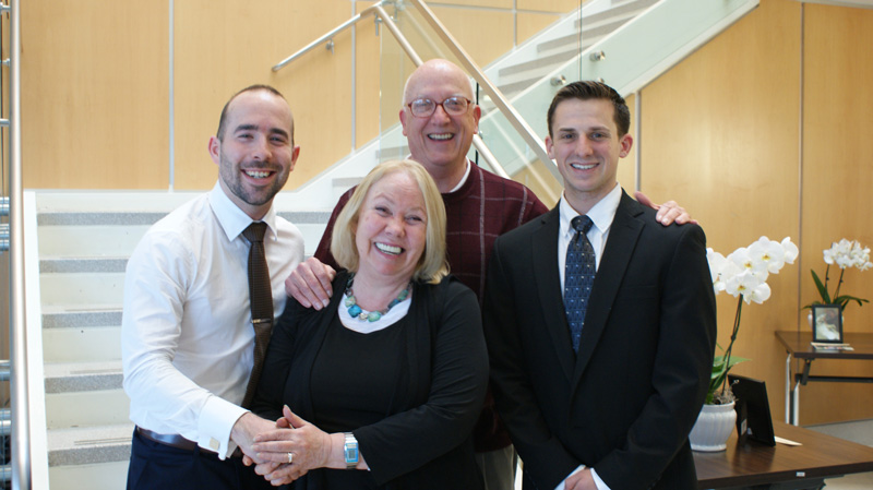 Physical therapy graduate students Dan Chapman (left) and Tyler Tice (right) pose with Dana and Leslie Shreve, whose mother Ginny donated her body to the University of Delaware College of Health Sciences. 