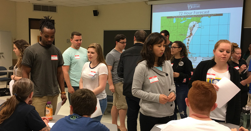 Students take on various disaster-management roles for a classroom exercise in which a fictitious hurricane strikes Delaware.