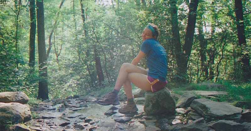 Summit alumna Emma Groman enjoys a moment of reflection along the Appalachian Trail during Summit 2016.