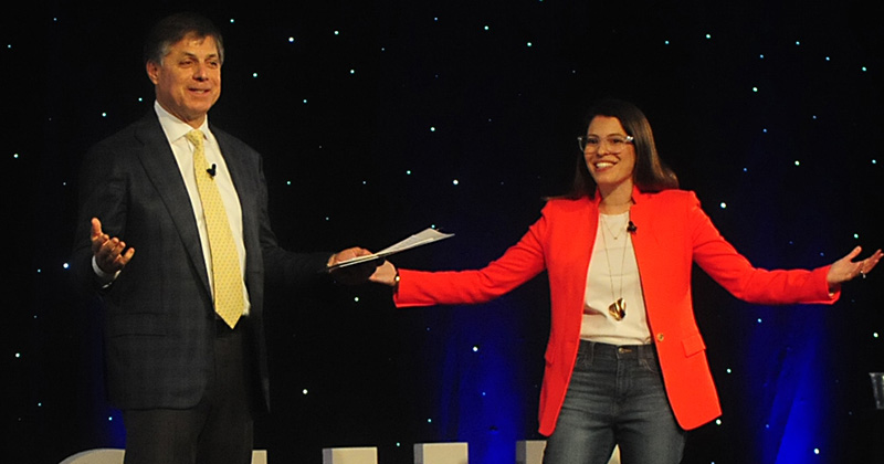 University of Delaware alumnus Rob Siegfried, Class of 1981 and guest speaker Michelle Poler take the stage at the semi-annual Siegfried Youth Leadership Program.