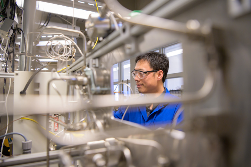 CHEG-Xu_Bingjun-Environmental_Portrait-110118 Bingjun Xu, assistant professor of Chemical and Biomolecular Engineering, working in his Colburn Lab office and laboratory. Photographed for the College of Engineering. - (Evan Krape / University of Delaware)