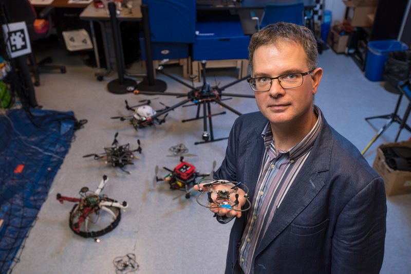 Burt Tanner has been recongized as a Fellow of the American Society of Mechanical Engineers. He is standing in his lab in Spencer amongst the drones he has had a hand in developing.  (Releases were obtained.)