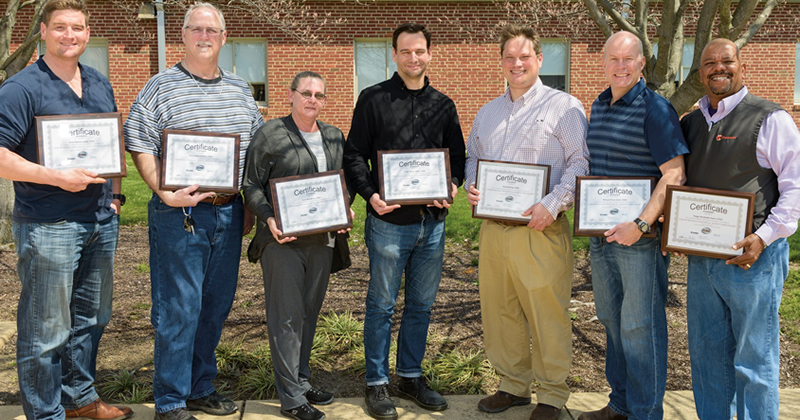 Safety program graduates displaying their course certificates