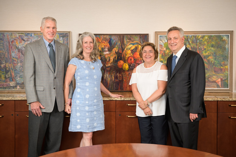 DAR-Baldt-Edward_Loper_Donation-090518 University of Delaware alumnus David Baldt, Sandra Baldt, Eleni Assanis and UD President Dennis Assanis stand in front of newly donated Edward Loper paintings that will now be part of the University’s collections.