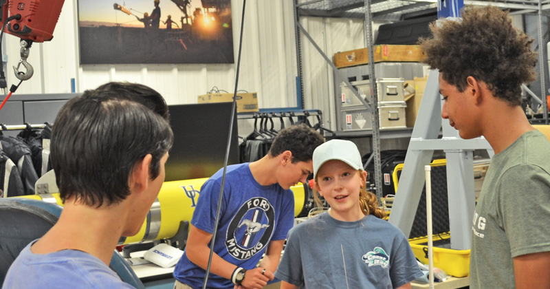 Anna Puleo (center) and her family got a tour of the Robotics Discovery Lab led by College of Earth, Ocean and Environment doctoral student Stephanie Dohner (left). 