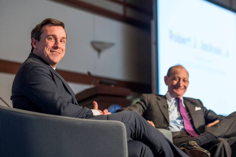 Charles Elson, Director, John L. Weinberg Center for Corporate Goverance invites Robert J. Jackson, Jr, Commissioner, U.S Securities and Exchange Commission to the stage for a fireside chat, March 20th, 2019. 

(Signage was posted around the event.)