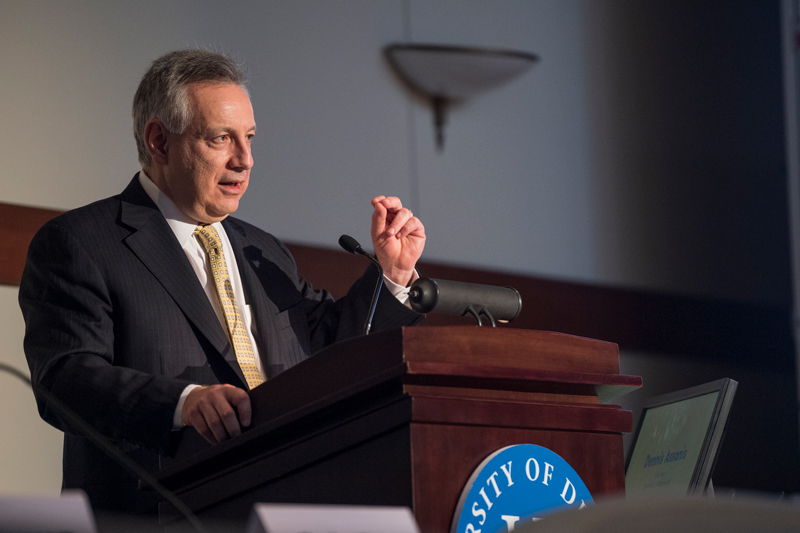 President Dennis Assanis gives remarks during the opening of the John L. Weinberg Center for Corportate Goverance talk, March 20th, 2019.  (Signage was posted around the event.)