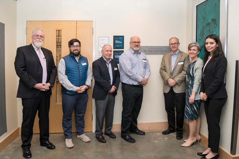 The Gore Dedication ceremony for the Materials Characterization Lab with Gore representatives Greg Hannon (tan Jacket), Amy Calhoun (green/tan sweater), Mike Daugherty (navy jacket), Jeff Ledford (blue striped shirt) along with speakers Gerry Poirer (green shirt) and Robin Morgan, March 26, 2019. (Photo releases were part of the registration materials.)