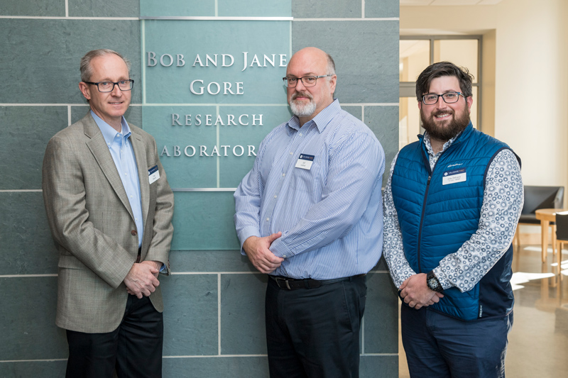 The Gore Dedication ceremony for the Materials Characterization Lab with Gore representatives Greg Hannon (tan Jacket), Amy Calhoun (green/tan sweater), Mike Daugherty (navy jacket), Jeff Ledford (blue striped shirt) along with speakers Gerry Poirer (green shirt) and Robin Morgan, March 26, 2019. (Photo releases were part of the registration materials.)